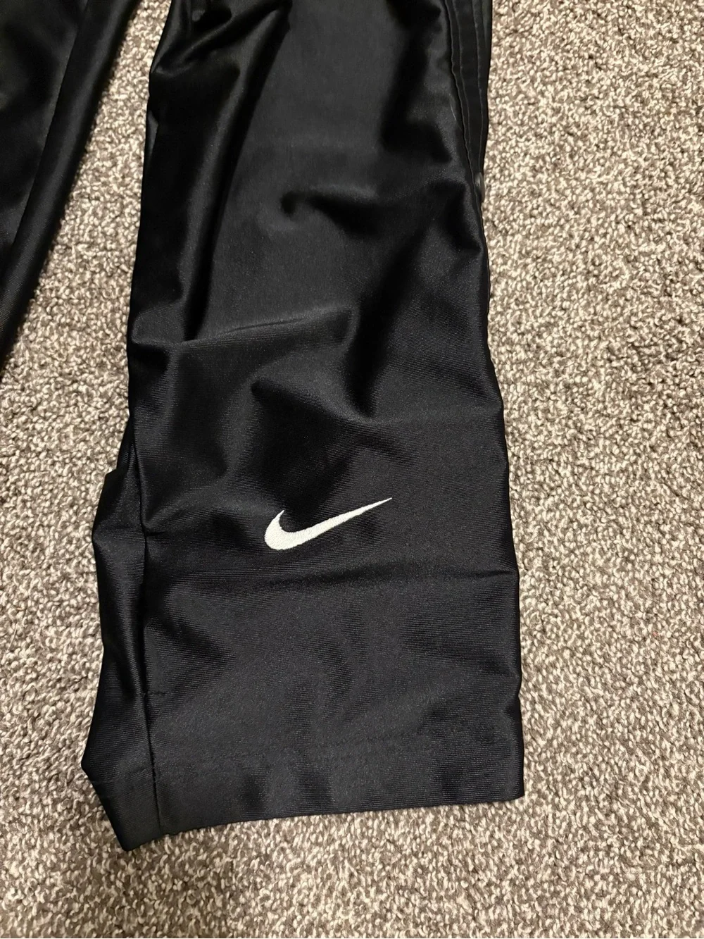Vintage Nike Black Snap-Button Track Pants with White Swoosh